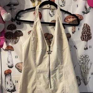 Halter shorts jumpsuit with star keychain zip up in the front.